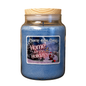 A large blue scented candle in a clear glass jar with a light wood lid, featuring a festive label that reads 'Home for the Holidays' with a snowy night scene and Santa Claus.